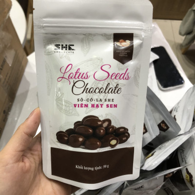 Socola viên Hạt sen - túi 50g -SHE Chocolate - Bổ sung năng lượng, đa dạng vị giác. Quà tặng sức khỏe, quà tặng người thân, dịp lễ, thích hợp ăn vặt