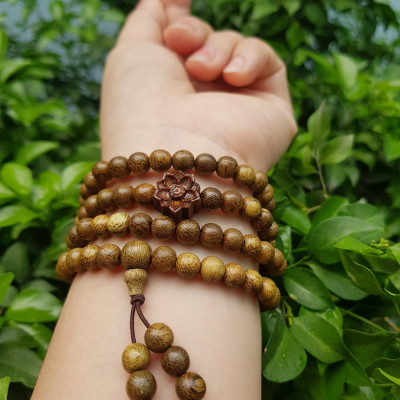 Vòng đeo tay nữ gỗ trầm mix bông hoa sen kiểu quấn tay 4 vòng may mắn tài lộc  Size hạt 6mm  Màu vàng nâu vân sáng nhẹ đeo tay rất đẹp xinh mùi thơm nhẹ nhẹ ạ